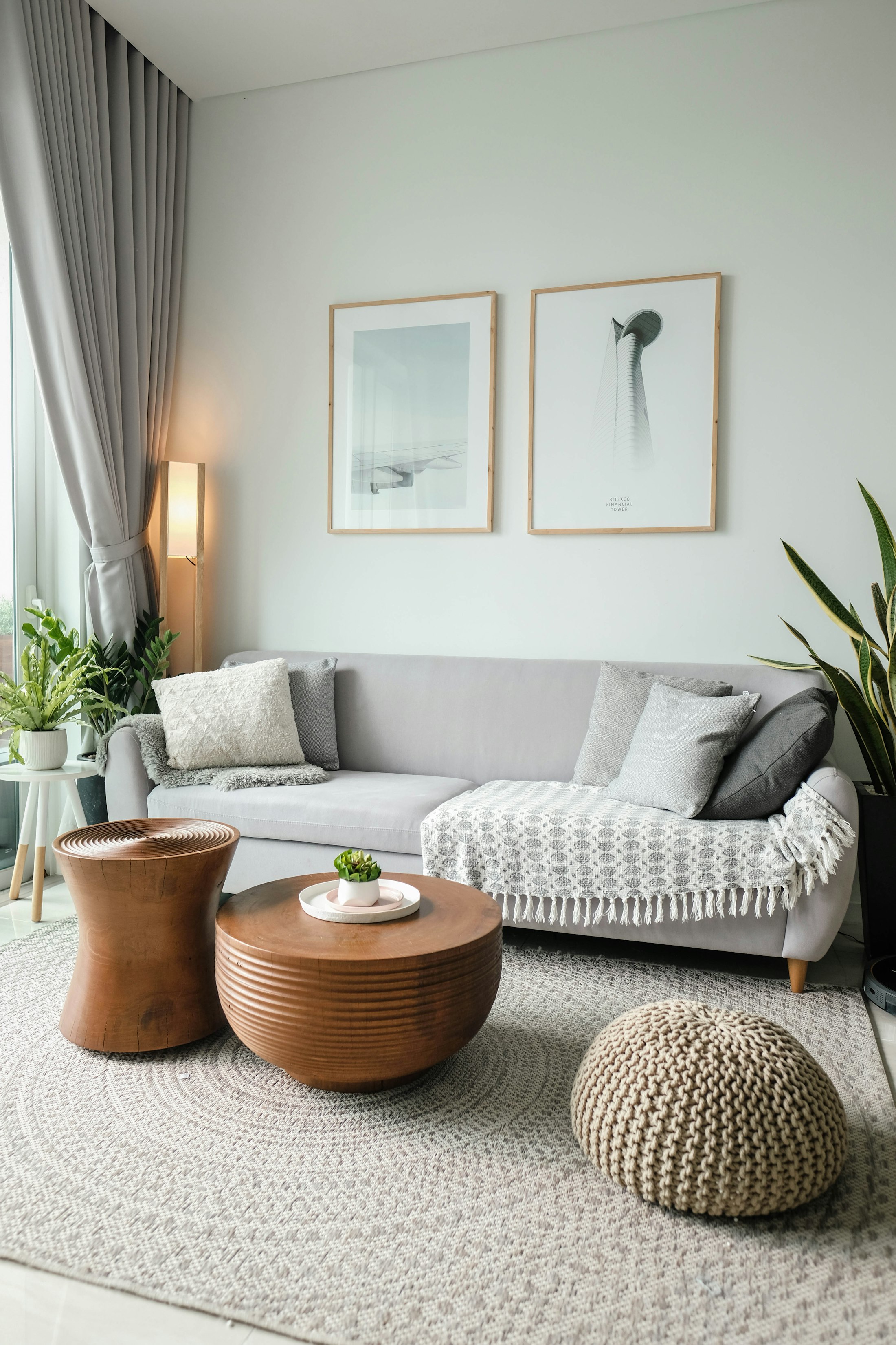 A warm, plant-filled seating area with soft natural light